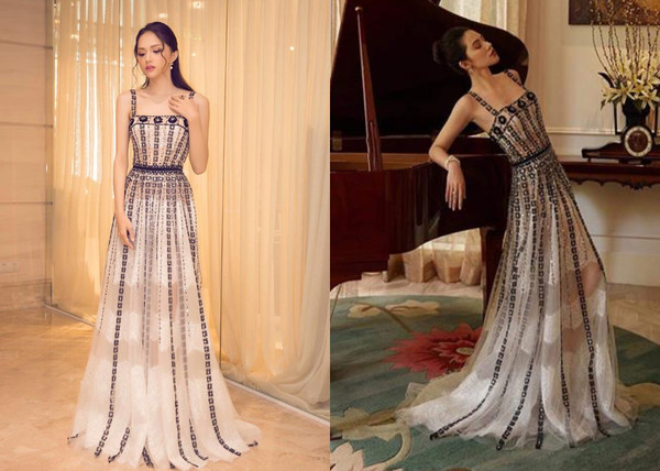 Hương Giang hóa thân thành nàng công chúa yêu kiều, thục nữ với chiếc đầm xòe hai dây. Với họa tiết hoa kết thành dây đính dọc theo thân váy cùng với chất vải xuyên thấu khiến cho Hương Giang toát lên sự nhẹ nhàng, nữ tính. Diện mạo này khiến cô được đánh giá cao tay hơn hẳn Hoa hậu con nhà giàu Jolie Nguyễn.  