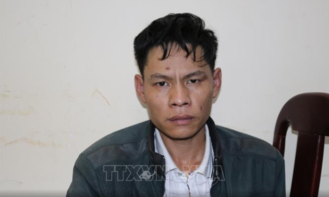Đối tượng Vi Văn Toán tại cơ quan điều tả - Ảnh: TTXVN