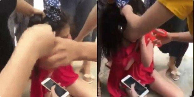 Cô gái bị nhóm phụ nữ đánh ghen cắt tóc. Ảnh cắt từ clip.