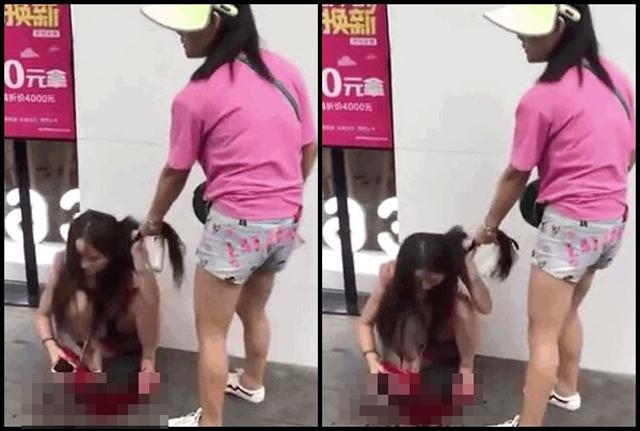 Người vợ đi đánh ghen bồ nhí của chồng bằng giày cao gót giữa phố.