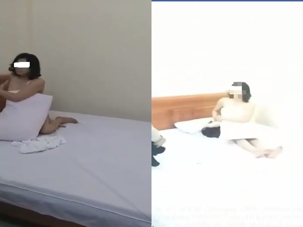 Nữ giáo viên bị chồng bắt quả tang vào nhà nghỉ với đồng nghiệp. Ảnh cắt từ clip.