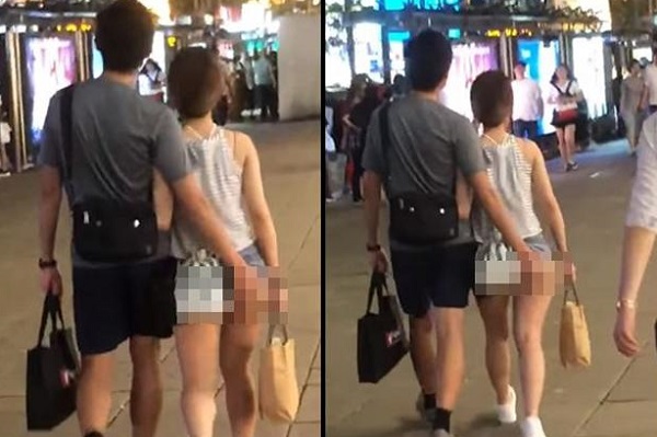 Chiếc quần ngắn cũn của cô gái và hành động phản cảm của anh chàng bên cạnh.