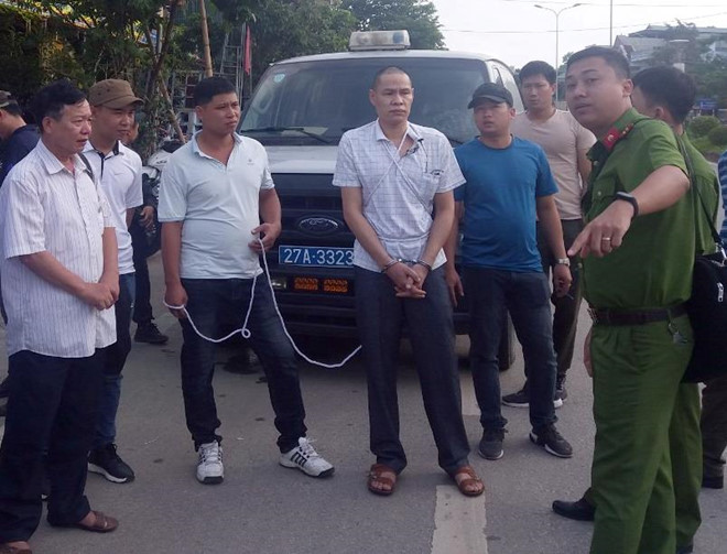 Vì Văn Toán tại buổi thực nghiệm điều tra. Ảnh: Đại Việt.