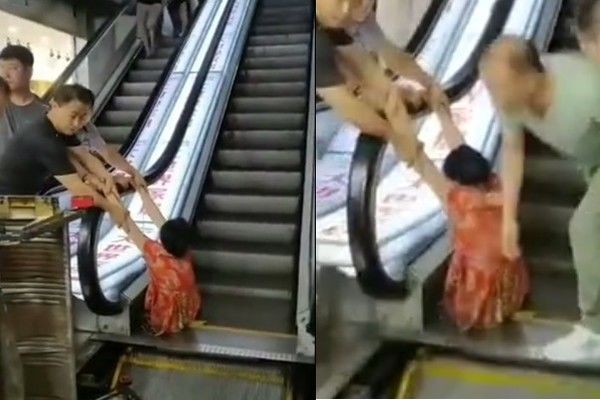 Người phụ nữ bị kẹt chân vào thang cuốn đau đớn.