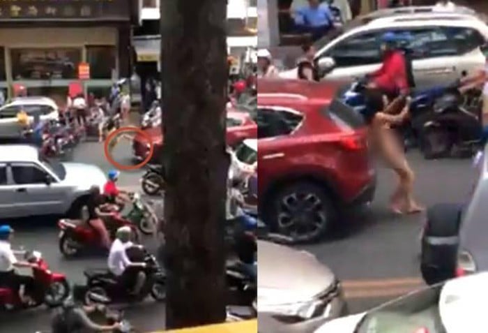 Hành động lạ của người phụ nữ khiến người đi đường ngỡ ngàng.