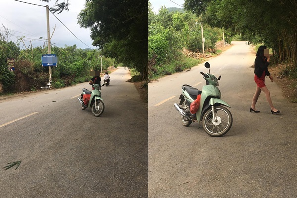 Người phụ nữ để xe giữa đường để nghe điện thoại.