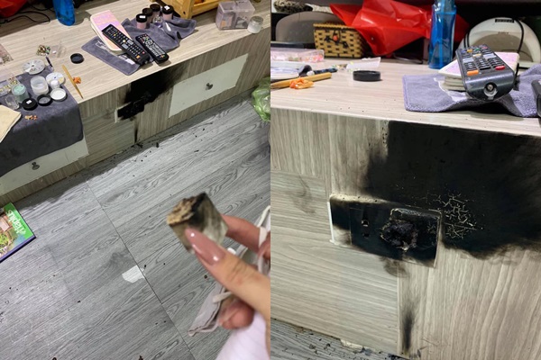 Chiếc ổ điện và chiếc sạc pin điện thoại của cô gái bị cháy đen thui.