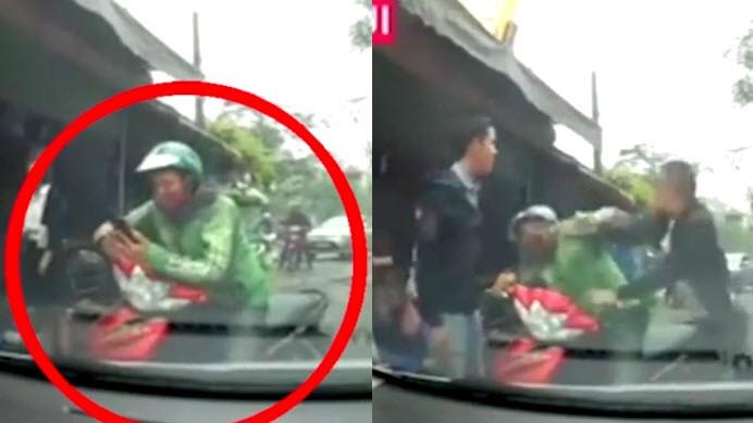 Tài xế Grab bị tài xế ô tô đánh tới tấp vì không nhường đường.