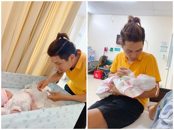 Chồng chăm con nhỏ để vợ nghỉ ngơi. 