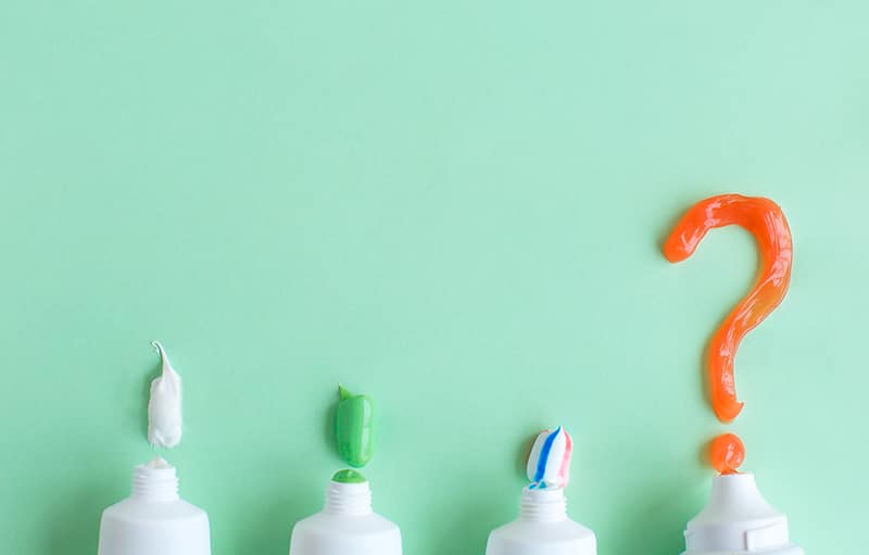toothpaste-lies-on-green-background-question