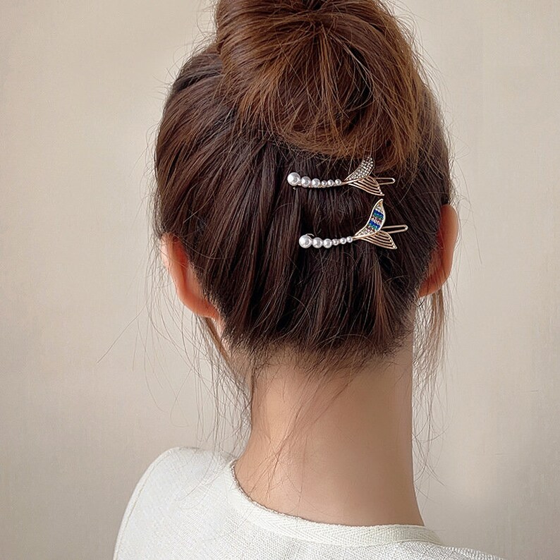 Tóc búi ngày hè sẽ giúp gương mặt bạn gọn gàng và thanh thoát hơn, đồng thời giải nhiệt, không khiến bạn bị bí bách khó chịu.    