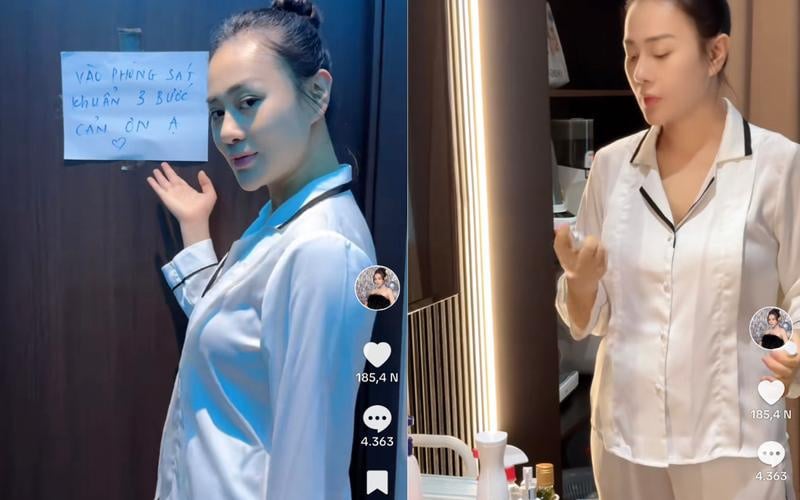 Phương Oanh nghiêm túc thực hiện việc sát khuẩn trước khi bế con.  