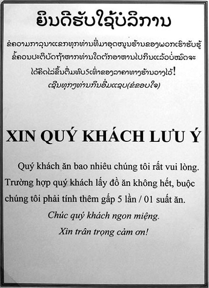 Biển cấm lấy thừa đồ ăn trong các bữa buffet ở Lào.
