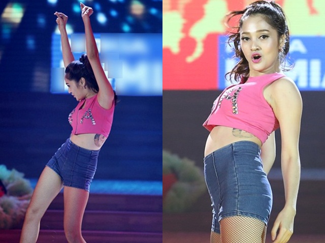 Bảo Anh mặc áo crop thể hiện điệu jive sôi động nên vô tình để lộ hình xăm rất lớn ngay dưới vùng ngực.