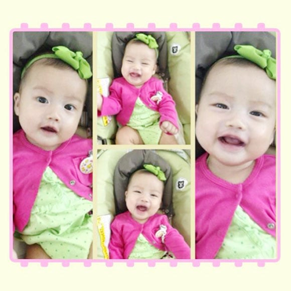 Dù còn nhỏ nhưng Cô la đã rất biết cách tạo hình trước ống kính.