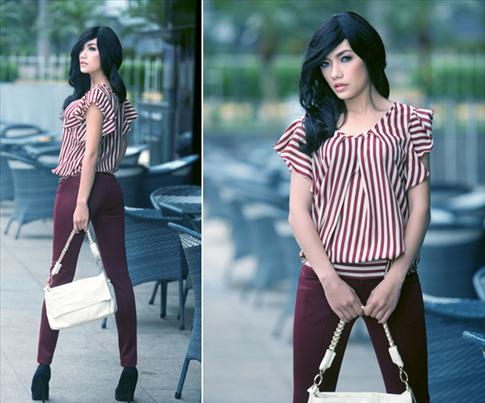 Tina Tình với khuôn mặt cứng đơ khi đội tóc giả.