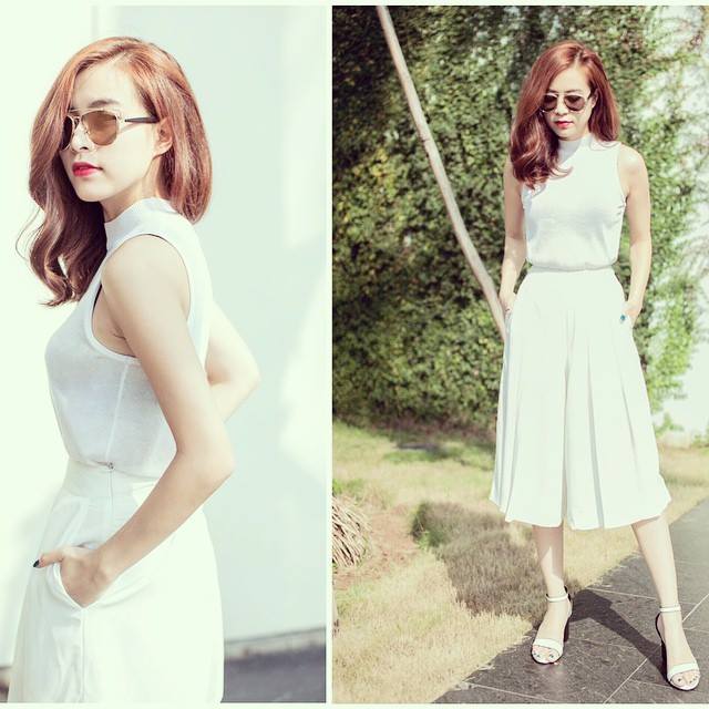 Hoàng Thùy Linh mặc cả cây trắng sành điệu đi chơi ngày nắng.