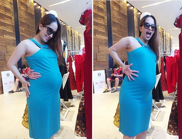 Bà bầu Khánh Thi cố gắng thực hiện thử thách chạm tay tới rốn nhưng không thành công: 'Tạm biệt vòng eo 56 cm lý tưởng. Giờ có vòng tay qua eo cũng khó mà chạm tới rốn. 56 đi xa mà 96 gọi mời quá'.
