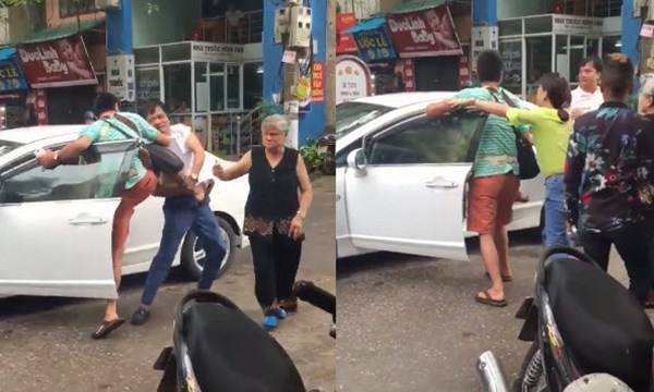 Ông bố địu con nhỏ đánh tài xế ôtô vì đỗ xe giữa đường