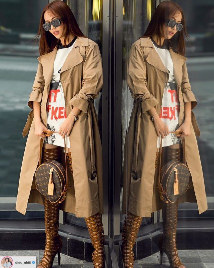 Diệu Nhi biến hoá phong cách với trench coat dáng dài màu camel, bốt cao cổ ấn tượng và túi xách Louis Vuitton nâu cùng tông.    