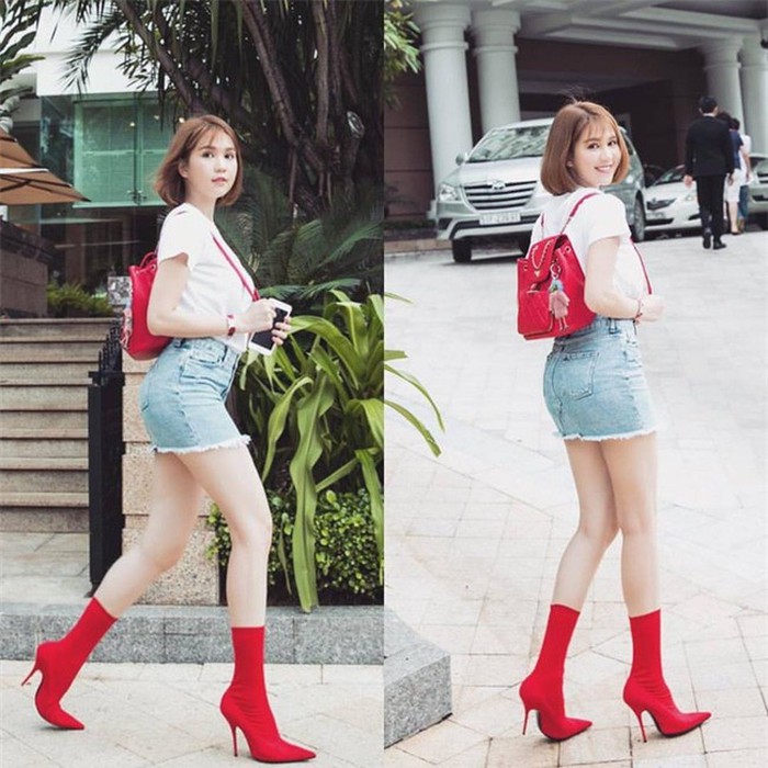 Khi đôi boots đỏ chẳng thể ăn nhập nổi với set đồ áo phông và váy jeans denim của Ngọc Trinh . Dù cô đã cố vớt vát diện thêm balo Chanel cùng tông màu nhưng xét một cách tổng thể vẫn kém tinh tế hẳn.    