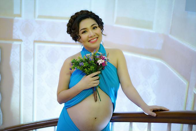 le-khanh-khoe-bung-bau-o-thang-thu-7-10_0_0