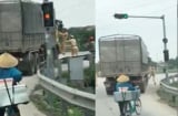 Bị yêu cầu dừng xe, tài xế xe tải nhấn ga bỏ chạy bất chấp 2 CSGT đang bám trên cửa