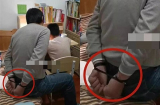 Ngồi dạy con làm bài tập về nhà nhưng ông bố lại tự trói tay mình sau lưng khiến mọi người tò mò