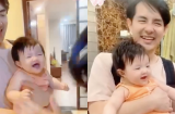 Đang nằm trọn trong vòng tay bố nhưng Winnie vẫn tranh thủ nịnh nọt mẹ Đông Nhi